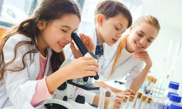 laboratory, teacher guiding to students for microscope and laboratory things, chemier laboratory chemicals.